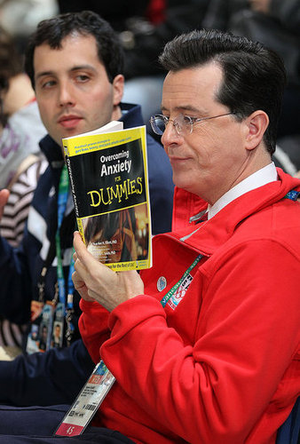 Photo of Stephen Colbert Reading Anxiety For Dummies at Olympics