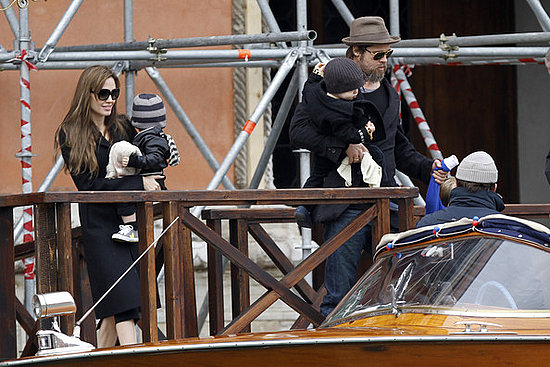 Brad Pitt and Angelina Jolie climb aboard a motor boat in Venice with their daughter Shiloh  and their twins