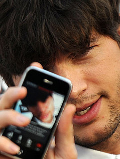 Pictures of Ashton Kutcher Using Ustream Live Broadcaster at The Joneses Premiere