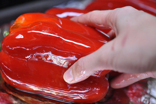 Coat each side of the bell pepper in olive oil and place the peppers in the preheated oven.
Coat each side of the bell pepper in olive oil and place the peppers in the preheated oven.