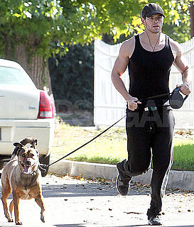 Pictures of Kellan Lutz Running With His Dog