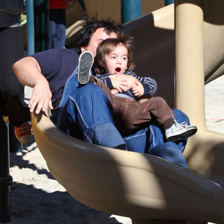 Guess Who's Taking a Ride Down a Slide?