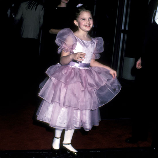 Seven-year-old Drew Barrymore attended the Golden Globes in 1983 to celebrate ET.
Seven-year-old Drew Barrymore attended the Golden Globes in 1983 to celebrate ET.