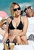 Pictures of Chloë Sevigny Sunbathing in a Black Bikini in South Beach