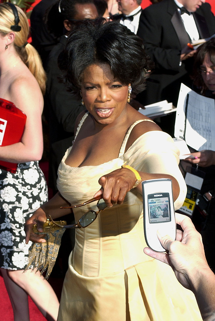 She pointed to cameras while walking the carpet for the 2002 Primetime Emmy Awards. 
