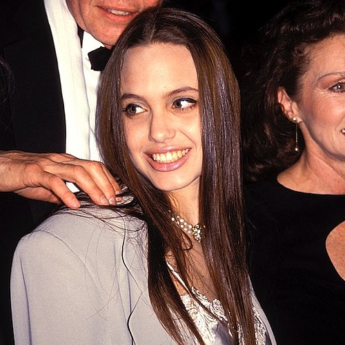 In 1991, a young Angelina, wearing her hair much the same as she does today, attended a play with her family.
In 1991, a young Angelina, wearing her hair much the same as she does today, attended a play with her family.
