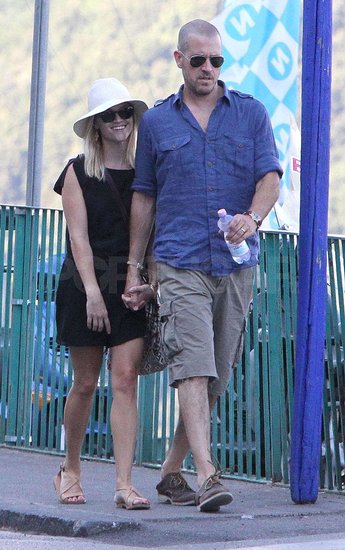 Reese Witherspoon held hands with Jim Toth. Reese Witherspoon held hands with Jim Toth.