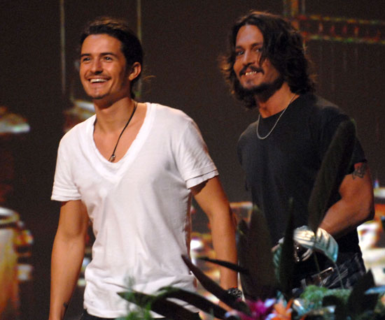 Pirates of the Caribbean costars Orlando Bloom and Johnny Depp accepted a colorful surfboard award in 2006.
Pirates of the Caribbean costars Orlando Bloom and Johnny Depp accepted a colorful surfboard award in 2006.