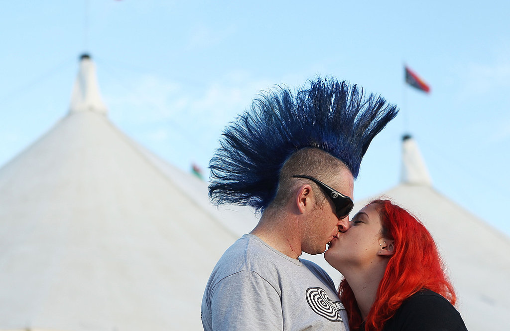 Donning brightly colored hair, this twosome shared a kiss at the Bluesfest Music Festival in Byron Bay, Australia.
Donning brightly colored hair, this twosome shared a kiss at the Bluesfest Music Festival in Byron Bay, Australia.