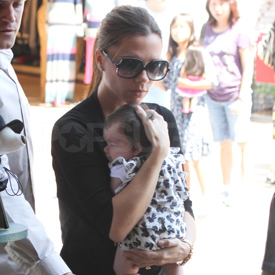 Victoria Beckham held little Harper close. Victoria Beckham held little Harper close.