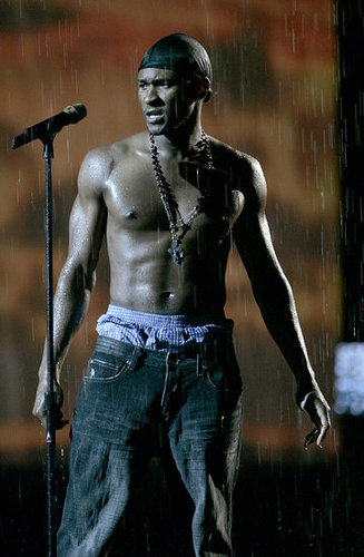 Usher rehearsed for the 2004 VMAs sans shirt and with fake rain falling in the background.
Usher rehearsed for the 2004 VMAs sans shirt and with fake rain falling in the background.