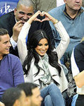 Supporting Her Man at a Nets vs. Mavericks Game
