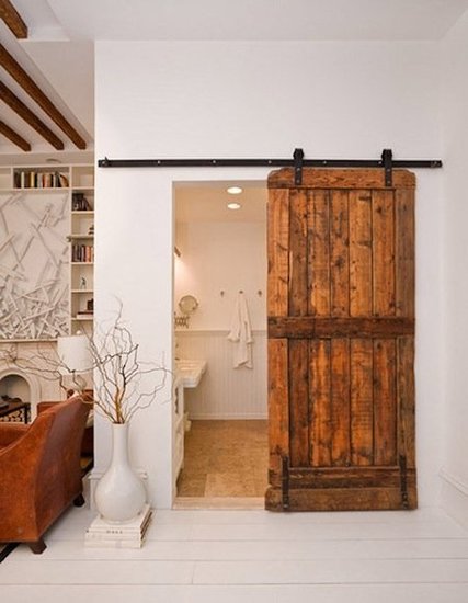 This reclaimed barn door adds so much warmth to sleek, white interiors. I love the idea of using a smaller, single door to cover a guest bathroom.
Source
This reclaimed barn door adds so much warmth to sleek, white interiors. I love the idea of using a smaller, single door to cover a guest bathroom.
Source