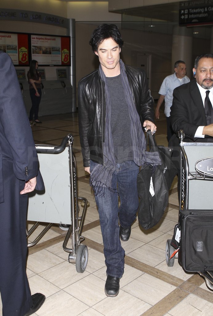 Ian Somerhalder had help with his bags. Ian Somerhalder had help with his bags.