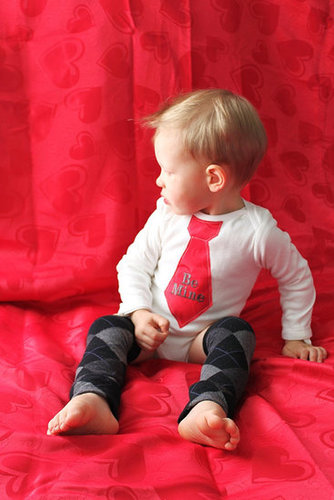 Favorite Like this item?  Add it to your favorites to revisit it later. Valentine's Day "Be Mine" Tie Onesie and Leg Warmers Set