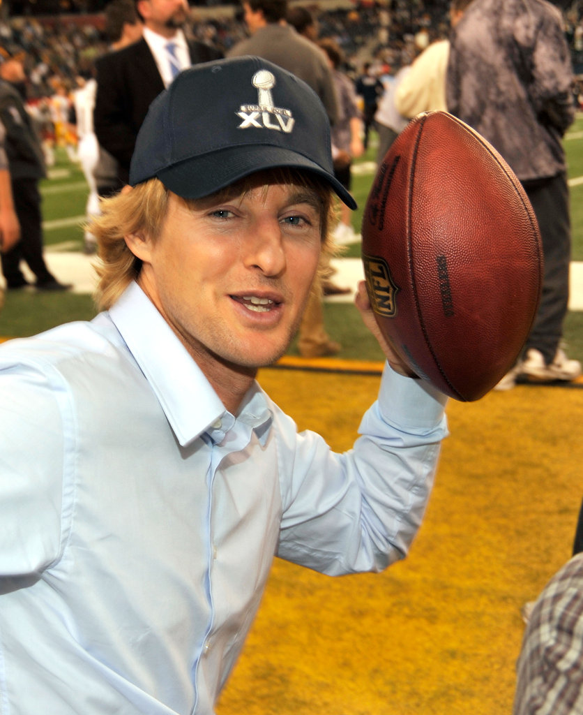 Owen Wilson posed with the pigskin on the sidelines in 2011.
Owen Wilson posed with the pigskin on the sidelines in 2011.