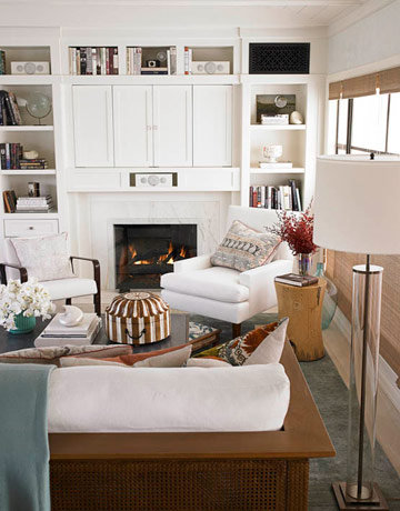 A different take on the flat screen over the fireplace, these cabinets hide electronics while the surrounding decorative shelving camouflages speakers among books and other knickknacks.
Source
A different take on the flat screen over the fireplace, these cabinets hide electronics while the surrounding decorative shelving camouflages speakers among books and other knickknacks.
Source