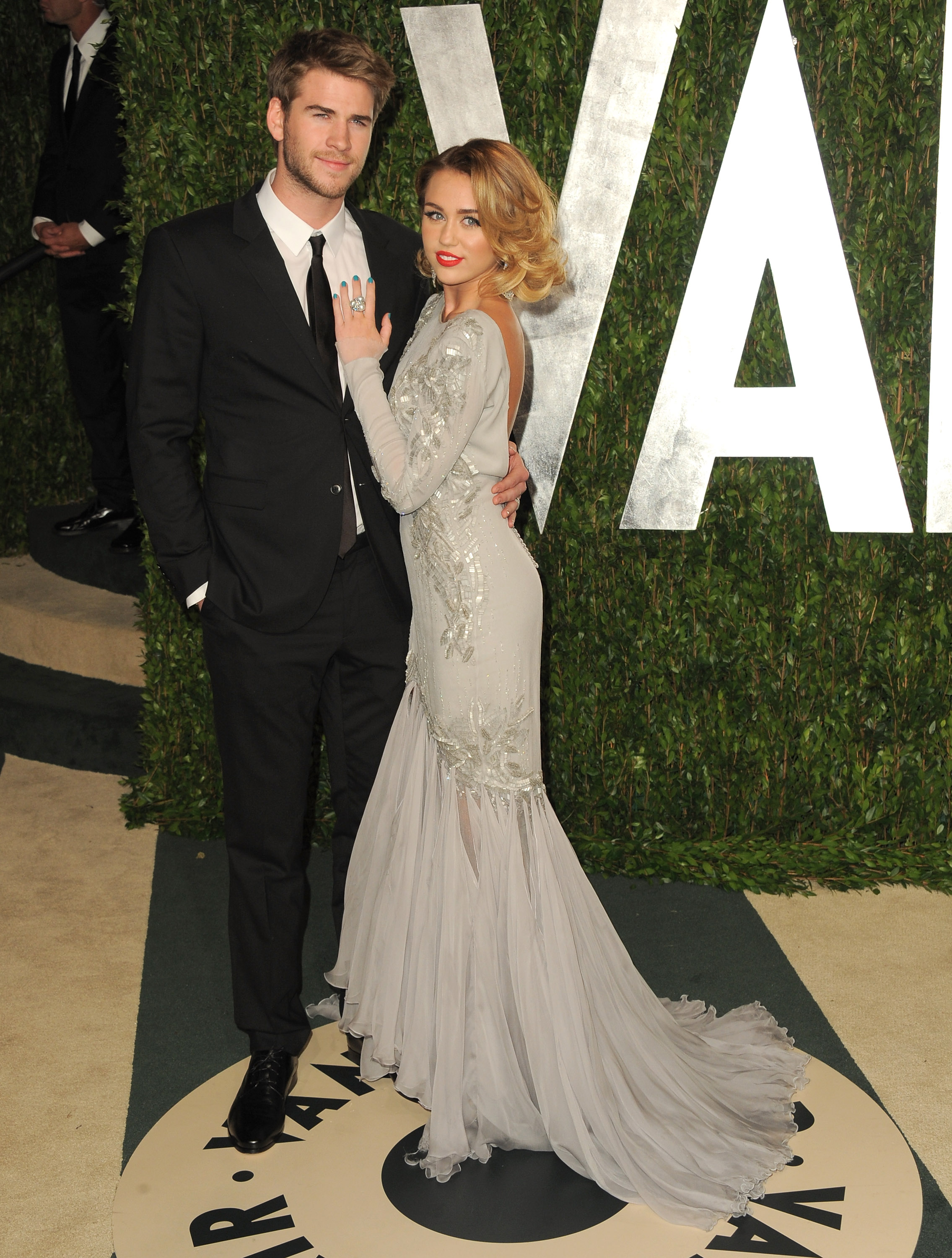 Miley Cyrus and Liam Hemsworth at Vanity Fair. Miley Cyrus and Liam Hemsworth at Vanity Fair.