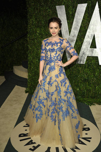Lily Collins in a violet-blue and nude Monique Lhuillier tulle gown.
Lily Collins in a violet-blue and nude Monique Lhuillier tulle gown.