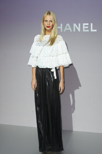 Poppy Delevigne chose a frilly white peasant top to accent her slick maxi skirt at the Chanel Fall '12 show.
Poppy Delevigne chose a frilly white peasant top to accent her slick maxi skirt at the Chanel Fall '12 show.