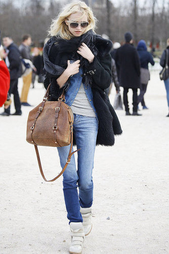 Isabel Marant kicks amp up basic denim — as does a furry black coat.
Isabel Marant kicks amp up basic denim — as does a furry black coat.