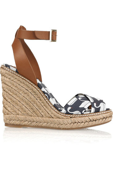The Quintessential Wedge Sandal
No Spring/Summer shoe collection is complete without an espadrille-inspired variation. In this case, we love this quirky swan print paired up with a slick ankle strap and rope wedge detail. These sandals will look super cute with a breezy minidress, a pair of jeans, or even chino trousers.
Tory Burch Swan-Print Wedge Sandals ($105, originally $175)
The Quintessential Wedge Sandal
No Spring/Summer shoe collection is complete without an espadrille-inspired variation. In this case, we love this quirky swan print paired up with a slick ankle strap and rope wedge detail. These sandals will look super cute with a breezy minidress, a pair of jeans, or even chino trousers.
Tory Burch Swan-Print Wedge Sandals ($105, originally $175)