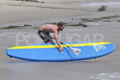 Robert Pattinson was on the beach shirtless.
Robert Pattinson was on the beach shirtless.