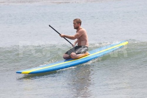 Robert Pattinson went paddleboarding shirtless.
Robert Pattinson went paddleboarding shirtless.