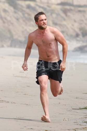 Robert Pattinson wore black shorts.
Robert Pattinson wore black shorts.