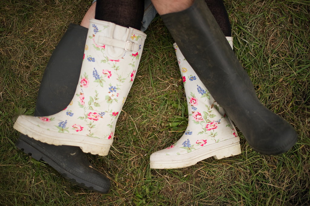 A couple in rainboots laid in the grass at the Big Chill festival near Ledbury in Herefordshire, England.
A couple in rainboots laid in the grass at the Big Chill festival near Ledbury in Herefordshire, England.