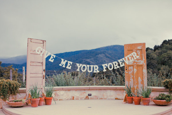 If you share a sweet, special saying as a couple, then create a hanging banner to personalize your ceremony.
Photo by Jason + Anna Photography via Style Me Pretty
If you share a sweet, special saying as a couple, then create a hanging banner to personalize your ceremony.
Photo by Jason + Anna Photography via Style Me Pretty