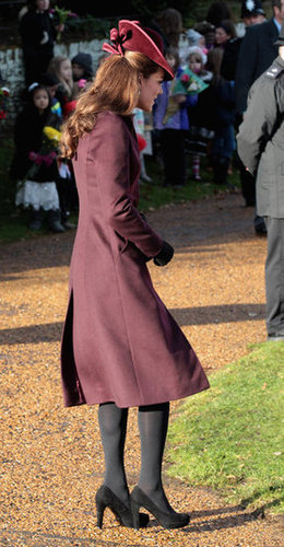 A side view of Kate's burgundy coat and fascinator on Christmas morning.
A side view of Kate's burgundy coat and fascinator on Christmas morning.