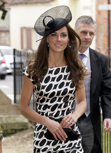 Kate Middleton wore an oval-printed Zara dress with Links of London earrings and an Anya Hindmarch clutch to a family friend's wedding last year.
Kate Middleton wore an oval-printed Zara dress with Links of London earrings and an Anya Hindmarch clutch to a family friend's wedding last year.