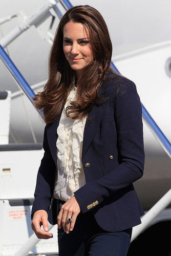 The Duchess of Cambridge chose a ruffle-font House of Fraser cream blouse with a navy Smythe blazer and J Brand skinny jeans for a day in Alberta, Canada, in July 2011.
The Duchess of Cambridge chose a ruffle-font House of Fraser cream blouse with a navy Smythe blazer and J Brand skinny jeans for a day in Alberta, Canada, in July 2011.