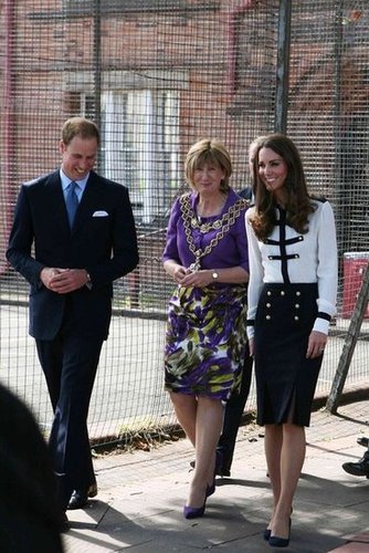 Kate looked military-inspired chic in an Alexander McQueen blouse and skirt set.
Kate looked military-inspired chic in an Alexander McQueen blouse and skirt set.