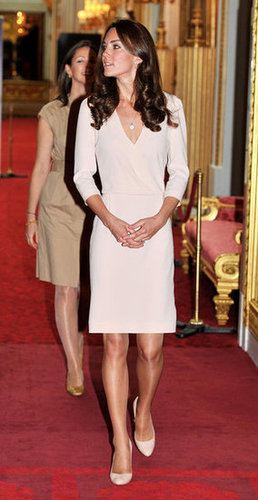 Kate was the picture of cream perfection in a Joseph sheath and Jimmy Choo pumps as she viewed the exhibitions for the Summer opening of Buckingham Palace in July 2011.
Kate was the picture of cream perfection in a Joseph sheath and Jimmy Choo pumps as she viewed the exhibitions for the Summer opening of Buckingham Palace in July 2011.