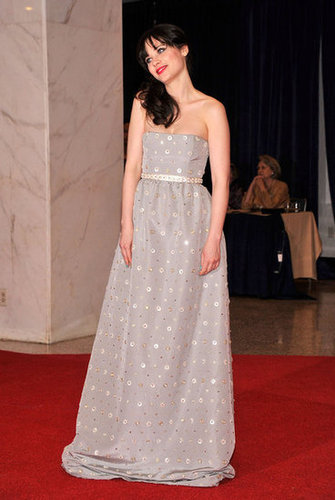 Zooey Deschanel wore a strapless silver gown.
Zooey Deschanel wore a strapless silver gown.