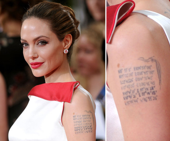 Angelina Jolie has the geographical coordinates of each of her six children's birth places on her left arm. The last coordinate is the latitude and longitude of Shawnee, OK, where soon-to-be husband Brad Pitt was born. The ink covers a former dragon tattoo and her ex's name, Billy Bob.
Angelina Jolie has the geographical coordinates of each of her six children's birth places on her left arm. The last coordinate is the latitude and longitude of Shawnee, OK, where soon-to-be husband Brad Pitt was born. The ink covers a former dragon tattoo and her ex's name, Billy Bob.