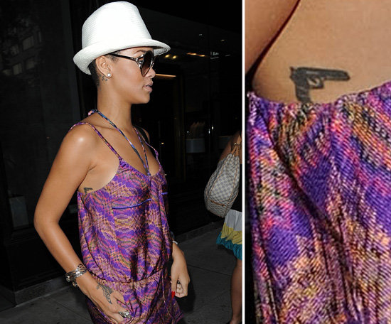 A gun is inked on Rihanna's right side.
A gun is inked on Rihanna's right side.