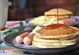 Sausages, scrambled eggs and old fashioned fluffy pancakes