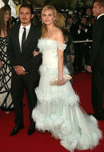 At the 2004 Troy world premiere, she walked arm in arm with Orlando Bloom and wore a feather-infused Chanel Haute Couture gown.
At the 2004 Troy world premiere, she walked arm in arm with Orlando Bloom and wore a feather-infused Chanel Haute Couture gown.