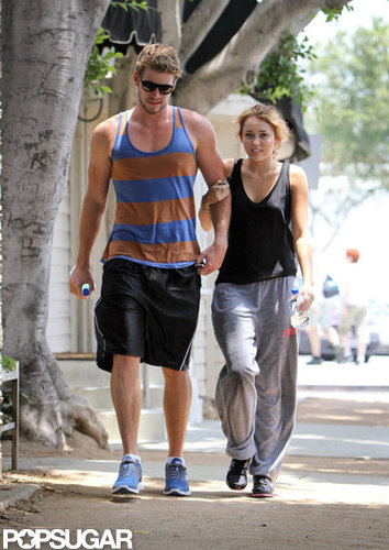 Liam Hemsworth and Miley Cyrus stuck together while walking in LA in July 2010.
Liam Hemsworth and Miley Cyrus stuck together while walking in LA in July 2010.