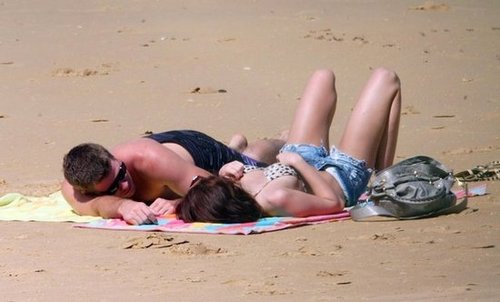 Miley Cyrus and Liam Hemsworth lounged on the beach in Australia in January 2010.
Miley Cyrus and Liam Hemsworth lounged on the beach in Australia in January 2010.