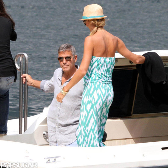Stacy Keibler and George Clooney boarded a boat. Stacy Keibler and George Clooney boarded a boat.