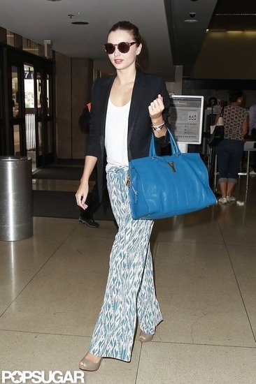 Miranda Kerr sported printed pants and shades at LAX. Miranda Kerr sported printed pants and shades at LAX.