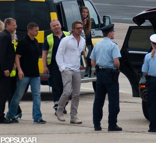 Brad Pitt walked through the airport tarmac. Brad Pitt walked through the airport tarmac.