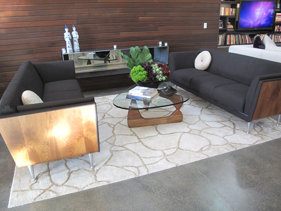 The living room seating area features a Noguchi coffee table. Ling's preference for a warm midcentury modern look is evident throughout the home.
The living room seating area features a Noguchi coffee table. Ling's preference for a warm midcentury modern look is evident throughout the home.