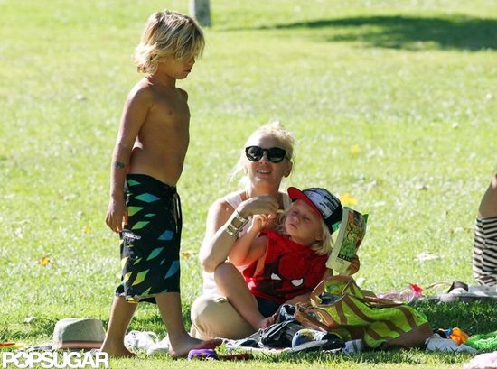 Kingston Rossdale wore his board shorts as he hung out with his mom and brother in the park. Kingston Rossdale wore his board shorts as he hung out with his mom and brother in the park.