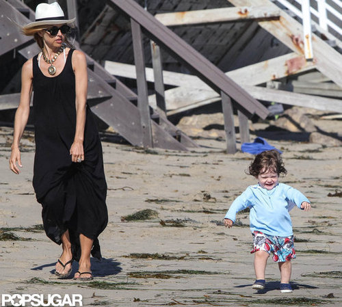 Rachel Zoe wore a long black maxi dress and hat for a day on the beach with Skyler.
Rachel Zoe wore a long black maxi dress and hat for a day on the beach with Skyler.