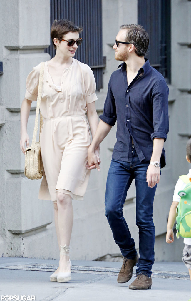 Anne Hathaway held hands with her fiancé. Anne Hathaway held hands with her fiancé.